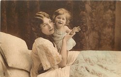 mother in bed with child, mother left, her right hand holds childsoutstretched left arm, child standing close to mothers left cheek