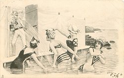 four girls in sea splash man with camera standing in door of bathing hut