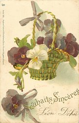 basket of many coloured pansies hanging from purple ribbon