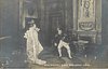 Image 1 - MME REJANE DANS MME. SANS-GENE elborately dressed actress stands left, man sits right