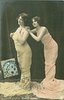 Image 2 - both stand facing left, looking left & up, both hands of girl on right on shoulder of girl in front