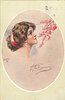 Image 1 - inset of pretty brunette with red hair band looking up right at pink blossom