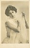 Image 1 - woman with filmy wrap around shoulders, right hand on her left shoulder