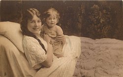 mother in bed with child, mother left, her left hand around child's left arm, her right hand is by child's right chest