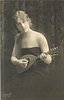 Image 1 - pretty girl with long hair in off shoulder dress faces partly left with mandolin held in before her, looks up & right