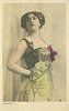 Image 1 - HAYGATE woman in elaborate dress with metallic breast plates, hand on hip