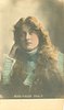 Image 3 - MISS MAUDE FEALY looking forward,long hair, right hand to ear, cuffs