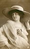 Image 1 - girl in panama hat, dress & filmy shawl faces partly right but looks over right shoulder to left of card