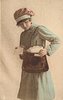 Image 1 - uniformed postlady delivering letters, faces left, looks down, opens satchel with her left hand, another letter in her right hand