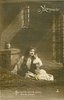 Image 1 - OUI, C'EST LUI PLUS DE PRISON, PLUS DE CHAINES! Marguerite sits on bed of twigs in prison, facing front, left hand raised to her ear