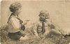 Image 2 - two boys play in straw, one aims toy pistol at the other