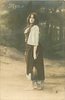 Image 1 - Mignon stands facing left, looking front