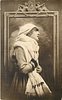 Image 1 - pretty girl with ermine fur & cap posed in front of framed mirror, she faces & looks right & up, both hands hold fur in front of her