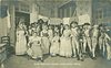 Image 1 - MME.REJANE DANS MME. SANS-GENE large group of actors & actresses, girl seated front left, soldiers with fixed bayonets right