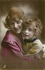 Image 1 - woman left, child right, woman right hand behind child, child left hand at woman's shoulder