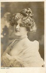 MANON LOTI young woman with low cut gown, pearls, wavy curls come down on either side of face, faces left
