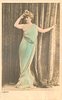 Image 3 - LABADY woman standing faces front, looks half left, her right hand touches hair, left hand points right