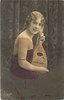 Image 1 - pretty girl with long hair in off shoulder dress faces right with mandolin held vertically on her lap, looks front