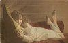 Image 2 - girl lying on couch holding pillow, facing left, looking front, feet up in air