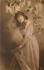 Image 2 - girl facing left leaning on step-ladder, looking front, holding rose with left hand, lilac above