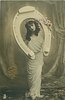 Image 3 - she holds up fantasy horseshoe & looks through it, flowers in her left hand