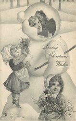 LOVING CHRISTMAS WISHES two small girls with mistletoe in front of snowman, woman's face inside his head