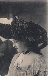 MISS GRACE LANE, head bowed, facing left and looking down