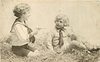 Image 1 - two boys play in straw, one aims toy pistol at the other