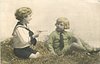 Image 3 - two boys play in straw,one aims toy pistol at the other