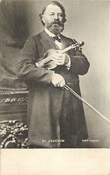 DR. JOACHIM holding violin