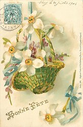 basket of narcissi & purple flowers hanging from thin blue ribbon