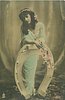 Image 1 - she leans with both arms on fantasy horseshoe in front of her