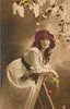Image 1 - girl facing right leaning on step-ladder, looking front, holding rose with right hand, lilac above