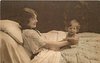 Image 1 - mother lying in bed smiling at baby sitting at arms length in front of her