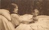 Image 1 - mother lying in bed smiling at baby sitting at arms length in front of her