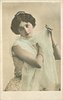 Image 3 - woman with filmy wrap around shoulders, right hand on her left shoulder