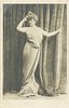 Image 5 - LABADY woman standing faces front, looks half left, her right hand touches hair, left hand points right