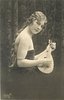Image 1 - pretty girl with long hair in off shoulder dress faces right with mandolin held before her, looks front, braid down her back