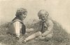 Image 1 - two boys play in straw, one eats tart, looking forward, the other boy watches him