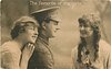 Image 1 - soldier between two girls, both girls look toward soldier, soldier faces right
