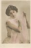 Image 6 - woman with filmy wrap around shoulders, right hand on her left shoulder