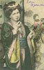 Image 1 - young woman in Japanese dress faces front smoking cigarette using long holder, head tilted to her right shoulder