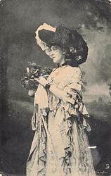 MISS GRACE LANE three quarter length costumed study, holding bouquet