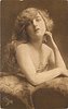 Image 1 - pretty girl poses, both elbows on fur, left hand to left side of face, right hand down on fur