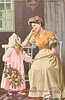 Image 1 - mother seated by table, daughter stands holding pink roses, they look into each others eyes