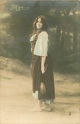 Mignon stands facing left, looking front